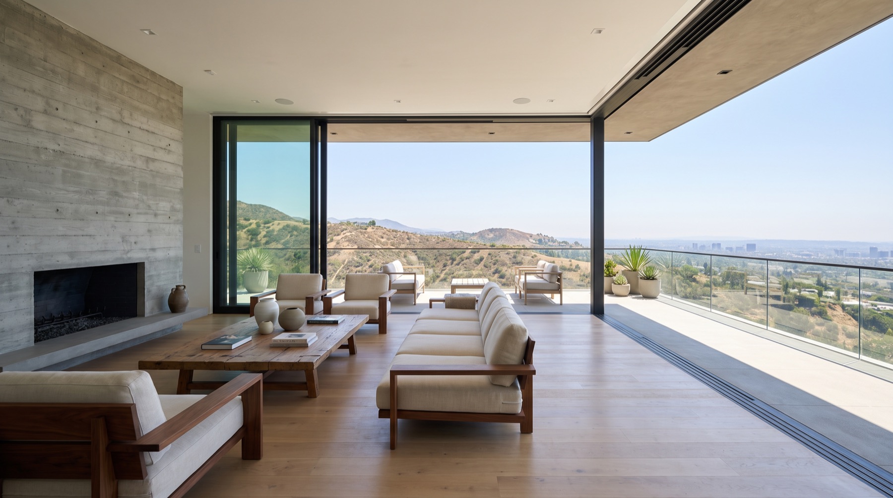 Great room with the glass wall pocketed open to the terrace