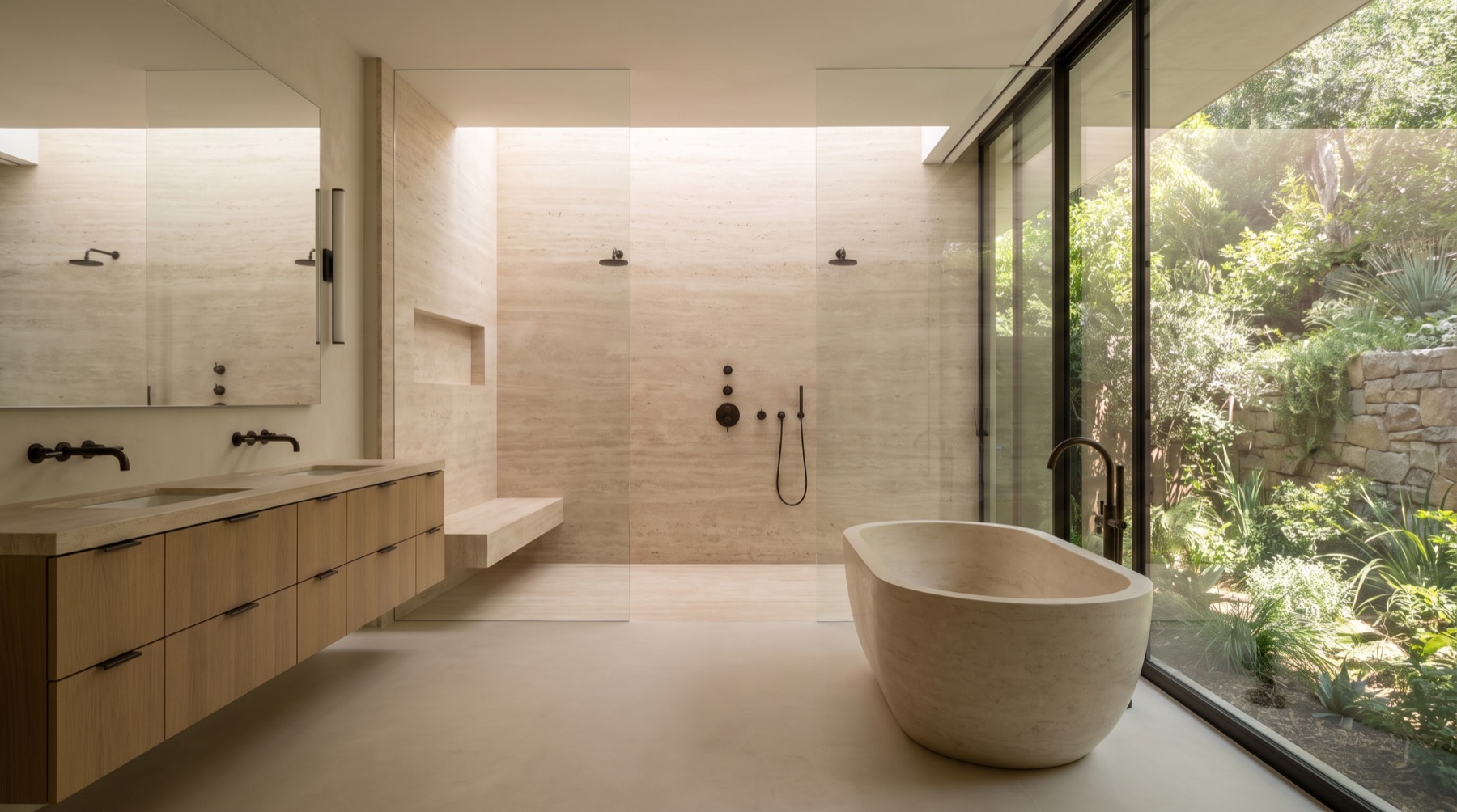 Primary bathroom wet room with a stone tub against courtyard glass